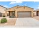 Charming single-story home featuring a two-car garage and low-maintenance desert landscaping in a residential neighborhood at 951 E Jacob St, Chandler, AZ 85225