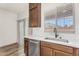 Cozy kitchen with stainless steel appliances, white countertops, and a bright window view at 951 E Jacob St, Chandler, AZ 85225
