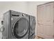 Laundry room featuring a full-size gray washer and dryer at 951 E Jacob St, Chandler, AZ 85225