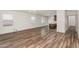 Spacious living room showcasing wood flooring and natural light from multiple windows at 951 E Jacob St, Chandler, AZ 85225