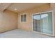 Outdoor patio featuring a stucco wall, window, and sliding glass door at 951 E Jacob St, Chandler, AZ 85225