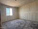Under-construction bedroom with window features drywall and concrete floors awaiting finishing touches and personalization at 9540 W Parkway Dr, Tolleson, AZ 85353