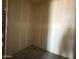 Under-construction closet features drywall and concrete floors awaiting finishing touches and personalization at 9540 W Parkway Dr, Tolleson, AZ 85353