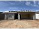 New home under construction showing the facade and a covered car port with a stacked tile roof and a blue sky background at 9540 W Parkway Dr, Tolleson, AZ 85353