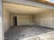 Spacious under-construction garage features drywall and concrete floors awaiting finishing touches at 9540 W Parkway Dr, Tolleson, AZ 85353