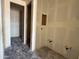 Under-construction kitchen with plumbing features drywall and concrete floors awaiting finishing touches and personalization at 9540 W Parkway Dr, Tolleson, AZ 85353