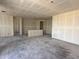 Spacious living room under construction with drywall and an open layout, awaiting finishing touches at 9540 W Parkway Dr, Tolleson, AZ 85353