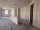 Wide open living room with visible doorway entries to other rooms and a light coat of primer on the walls and ceiling at 9540 W Parkway Dr, Tolleson, AZ 85353