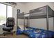 A bedroom features a metal frame bunkbed and study chair at 1108 S Lebanon Ln, Tempe, AZ 85288