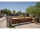 A single Gathering home featuring a unique wood and metal gated entry and a well-maintained front yard at 1108 S Lebanon Ln, Tempe, AZ 85288
