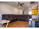 A spacious living room with wood-look flooring and a ceiling fan at 1108 S Lebanon Ln, Tempe, AZ 85288