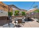 Outdoor patio with umbrellas and comfortable seating area at 12062 W Duane Ln, Peoria, AZ 85383