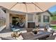 Inviting outdoor patio with seating and view of backyard at 12062 W Duane Ln, Peoria, AZ 85383