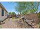 Private backyard oasis with gravel, hammock, artificial turf for workouts and mature trees for shade at 12062 W Duane Ln, Peoria, AZ 85383