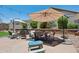 Outdoor patio with umbrellas and beautiful landscaping at 12062 W Duane Ln, Peoria, AZ 85383