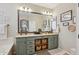 Bathroom featuring a dual sink vanity, granite countertops and wicker basket storage at 12062 W Duane Ln, Peoria, AZ 85383