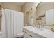 Bathroom featuring a single sink vanity, stone countertop and white shower curtain at 12062 W Duane Ln, Peoria, AZ 85383