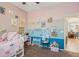 Colorful bedroom with a whimsical decor, a desk, and playful accents at 12062 W Duane Ln, Peoria, AZ 85383