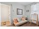 Comfortable secondary bedroom with a futon, soft colors, and a learning area with a whiteboard at 12062 W Duane Ln, Peoria, AZ 85383