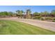 Community entrance with lush landscaping and impressive tower welcoming residents and guests at 12062 W Duane Ln, Peoria, AZ 85383
