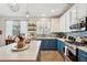 Stylish kitchen with modern stainless steel appliances, two-tone cabinets, and a stunning countertop at 12062 W Duane Ln, Peoria, AZ 85383