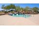 Community pool with wading area and waterslides for residents to enjoy on a sunny day at 12062 W Duane Ln, Peoria, AZ 85383