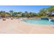 Community pool with wading area and waterslides for residents to enjoy on a sunny day at 12062 W Duane Ln, Peoria, AZ 85383