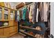 Walk-in closet with a custom storage system, built-in shelving and clothing racks at 12062 W Duane Ln, Peoria, AZ 85383