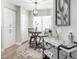 Bright dining area featuring a round table, bar cart, and modern decor with white cabinets and natural light at 15252 N 100Th St # 1154, Scottsdale, AZ 85260