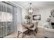 Chic dining area features stylish light fixture, seating for six, and modern decor at 15252 N 100Th St # 1154, Scottsdale, AZ 85260