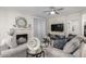 Cozy living room featuring a fireplace, ceiling fan, and neutral decor, perfect for relaxing and entertaining guests at 15252 N 100Th St # 1154, Scottsdale, AZ 85260