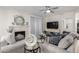 Comfortable living room with fireplace, ceiling fan, and sliding glass door at 15252 N 100Th St # 1154, Scottsdale, AZ 85260