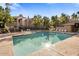 Inviting community pool surrounded by mature trees and ample seating for relaxation and enjoyment at 15252 N 100Th St # 1154, Scottsdale, AZ 85260