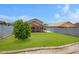 Lush backyard with green grass, mature tree, and covered patio, perfect for outdoor living at 2035 E Escuda Rd, Phoenix, AZ 85024