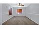 Cozy bedroom featuring neutral carpeting, wood blinds, and a modern ceiling fan at 2035 E Escuda Rd, Phoenix, AZ 85024