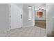 Bright entryway with tiled flooring and a view into a carpeted room with a ceiling fan at 2035 E Escuda Rd, Phoenix, AZ 85024