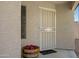 Welcoming front entry with security door and decorative flower arrangement for added curb appeal at 2035 E Escuda Rd, Phoenix, AZ 85024