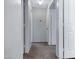 Neutral hallway with carpet and multiple white doors at 2035 E Escuda Rd, Phoenix, AZ 85024