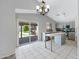 Bright kitchen with modern appliances, island, and a sliding glass door leading to a patio at 2035 E Escuda Rd, Phoenix, AZ 85024
