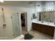 Bathroom featuring double sinks, shower, and a walk in closet at 21141 E Pecan Ln, Queen Creek, AZ 85142