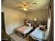 Charming bedroom featuring twin beds and floral wallpaper at 21141 E Pecan Ln, Queen Creek, AZ 85142