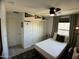 Comfortable bedroom with a ceiling fan and natural light at 21141 E Pecan Ln, Queen Creek, AZ 85142
