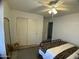 Bedroom with a bed, large closet, and a ceiling fan at 21141 E Pecan Ln, Queen Creek, AZ 85142