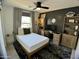 Well-lit bedroom with a modern design and desk area at 21141 E Pecan Ln, Queen Creek, AZ 85142
