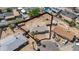 Spacious property featuring a home with mature trees and a large, partially developed yard at 3212 N 49Th Ln, Phoenix, AZ 85031