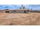 Backyard view of the home with a small block patio and space for personalization at 3212 N 49Th Ln, Phoenix, AZ 85031