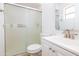 Bathroom featuring a sleek glass shower, modern vanity, and ample lighting at 3212 N 49Th Ln, Phoenix, AZ 85031