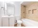 Bathroom with a modern vanity, mirror, and tiled shower and tub combo at 3212 N 49Th Ln, Phoenix, AZ 85031
