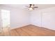 Bright bedroom featuring a ceiling fan and private access to a bathroom at 3212 N 49Th Ln, Phoenix, AZ 85031