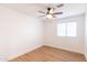 A cozy bedroom with a ceiling fan and a window to let in natural light at 3212 N 49Th Ln, Phoenix, AZ 85031